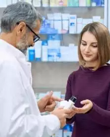 Woman purchasing medication from an expert long-term care pharmacist